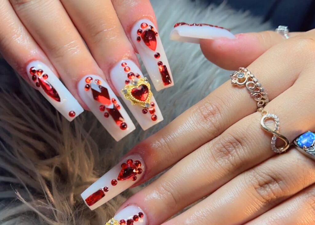 white nails red rubies